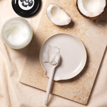Raw organic virgin coconut oil in a 500ml jar from Whole Food Earth, ideal for cooking and baking.