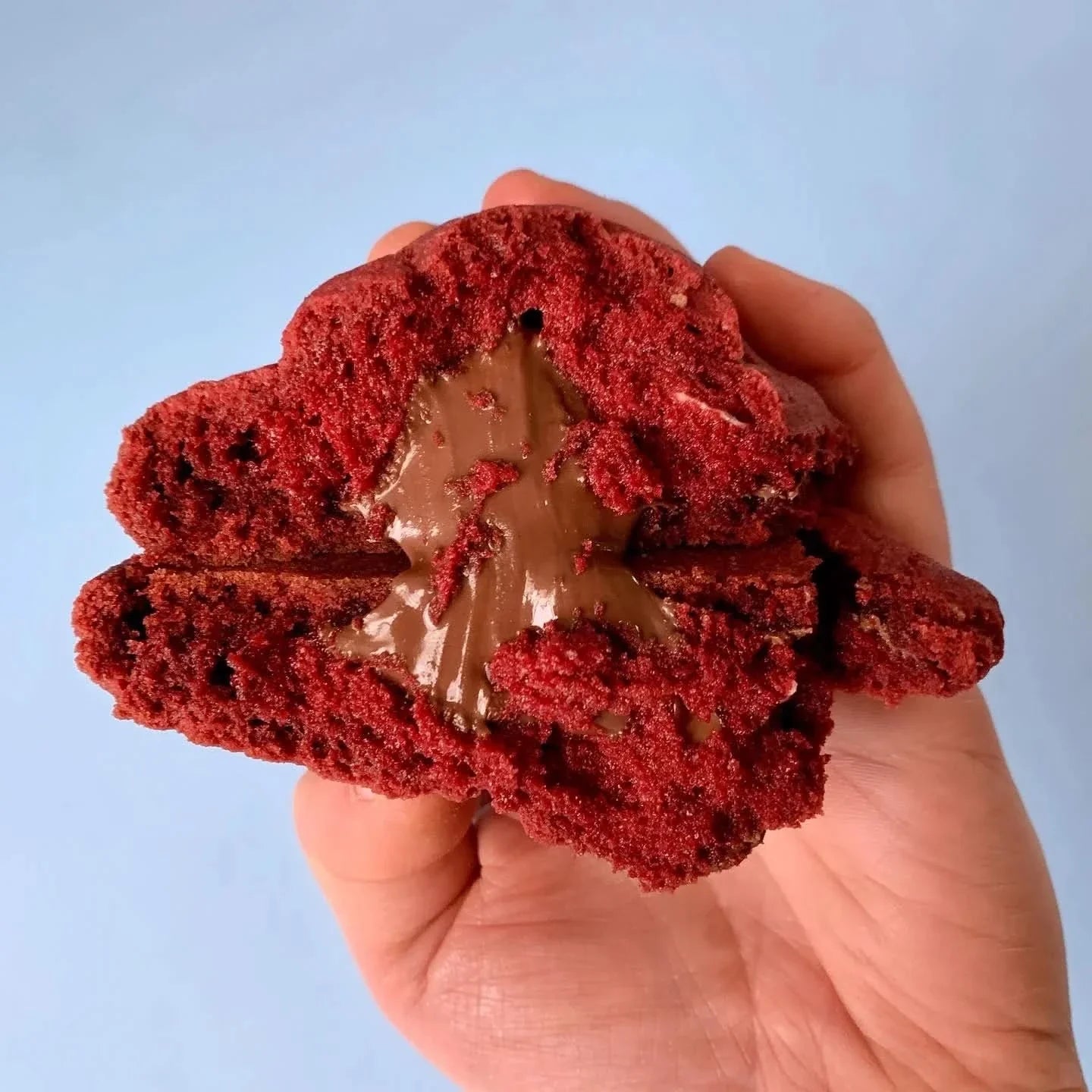 Red velvet and Nutella cookie from Cool Hog Snacks with a rich, chocolatey appearance and creamy Nutella filling.