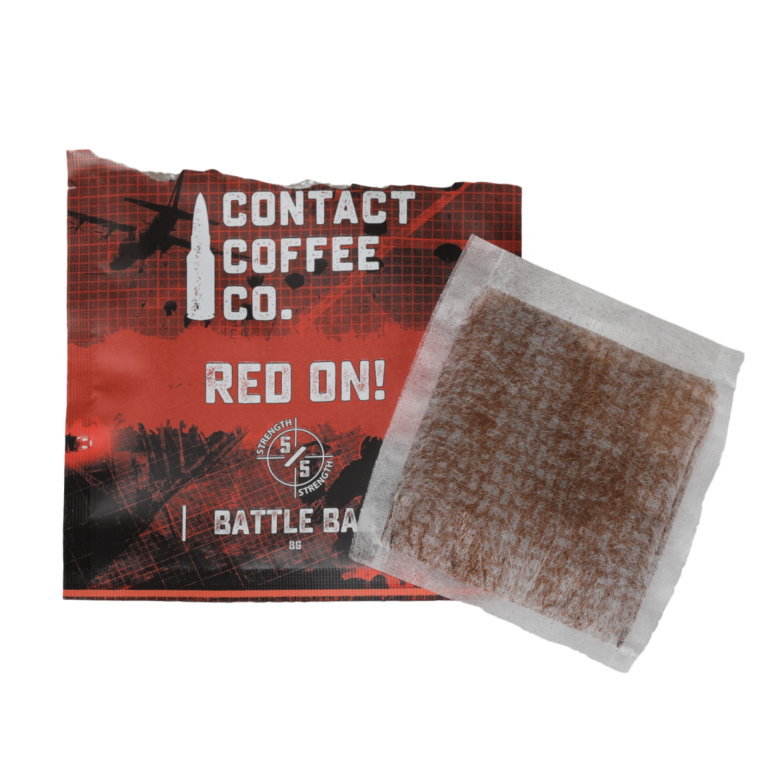 Red single-serve coffee brew bag from Contact Coffee Company Ltd., ready for brewing in a coffee cup.