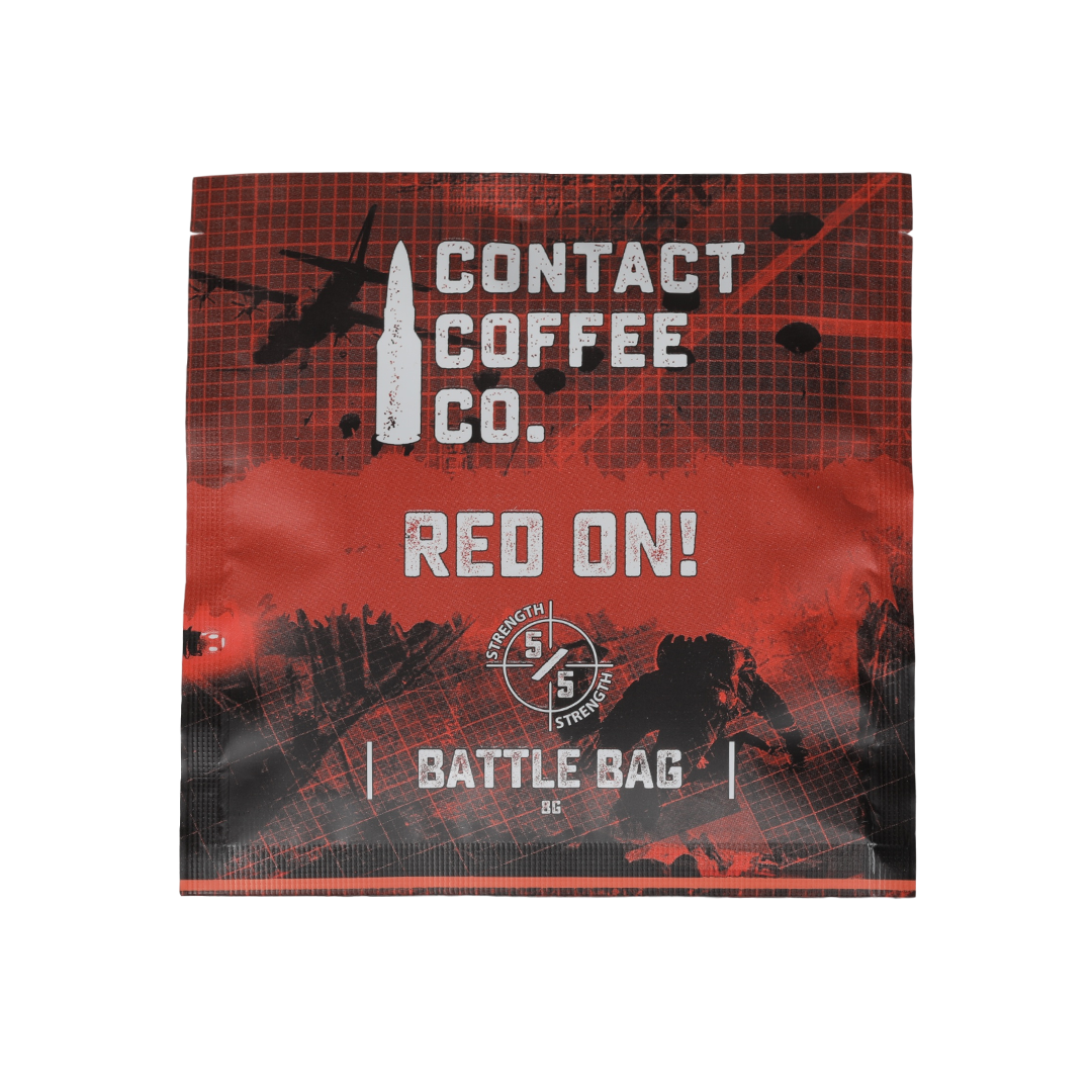 Red single serve coffee brew bag from Contact Coffee Company Ltd., ready for brewing, with vibrant red packaging.