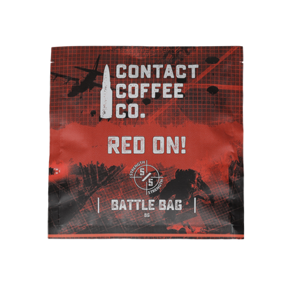 Red single serve coffee brew bag from Contact Coffee Company Ltd., ready for brewing, with vibrant red packaging.