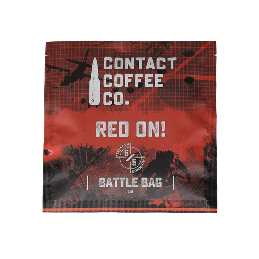Red single serve coffee brew bag from Contact Coffee Company Ltd., ready for brewing, with vibrant red packaging.