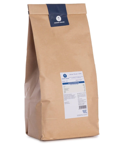 Two kilograms of Whole Food Earth 100% rice flour from Serious Grains in a clear bag, showing fine white rice powder.
