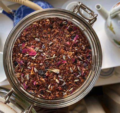 Porter Hill Tea Company's Rooibos De Provence tea in a teacup, showcasing the herbal red rooibos tea with a vibrant, rich color.
