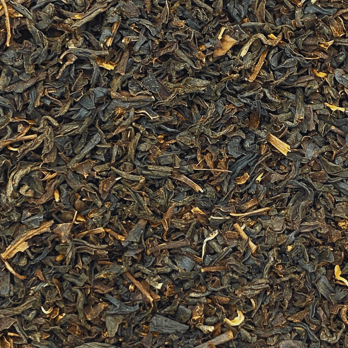 Loose leaf Russian Caravan black tea by Porter Hill Tea Company, showing dark, twisted tea leaves in a clear container.
