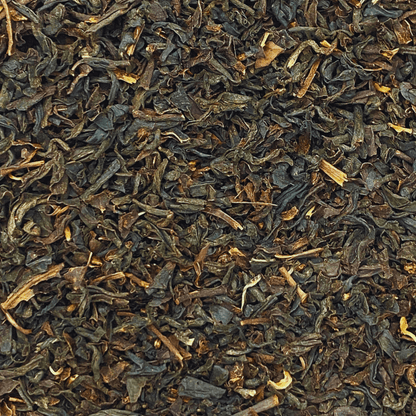 Loose leaf Russian Caravan black tea by Porter Hill Tea Company, showing dark, twisted tea leaves in a clear container.