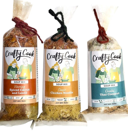 Assorted savory mini soup collection by Crafty Cook featuring three 2-serving meals in colorful bowls.