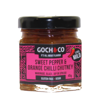 Sweet pepper and orange chilli chutney by Goch & Co, showing a jar of vibrant orange and red chutney with fresh peppers and chilies.