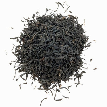 Black Santosa BOPS tea from Porter Hill Tea Company, showing loose tea leaves in a clear glass jar.