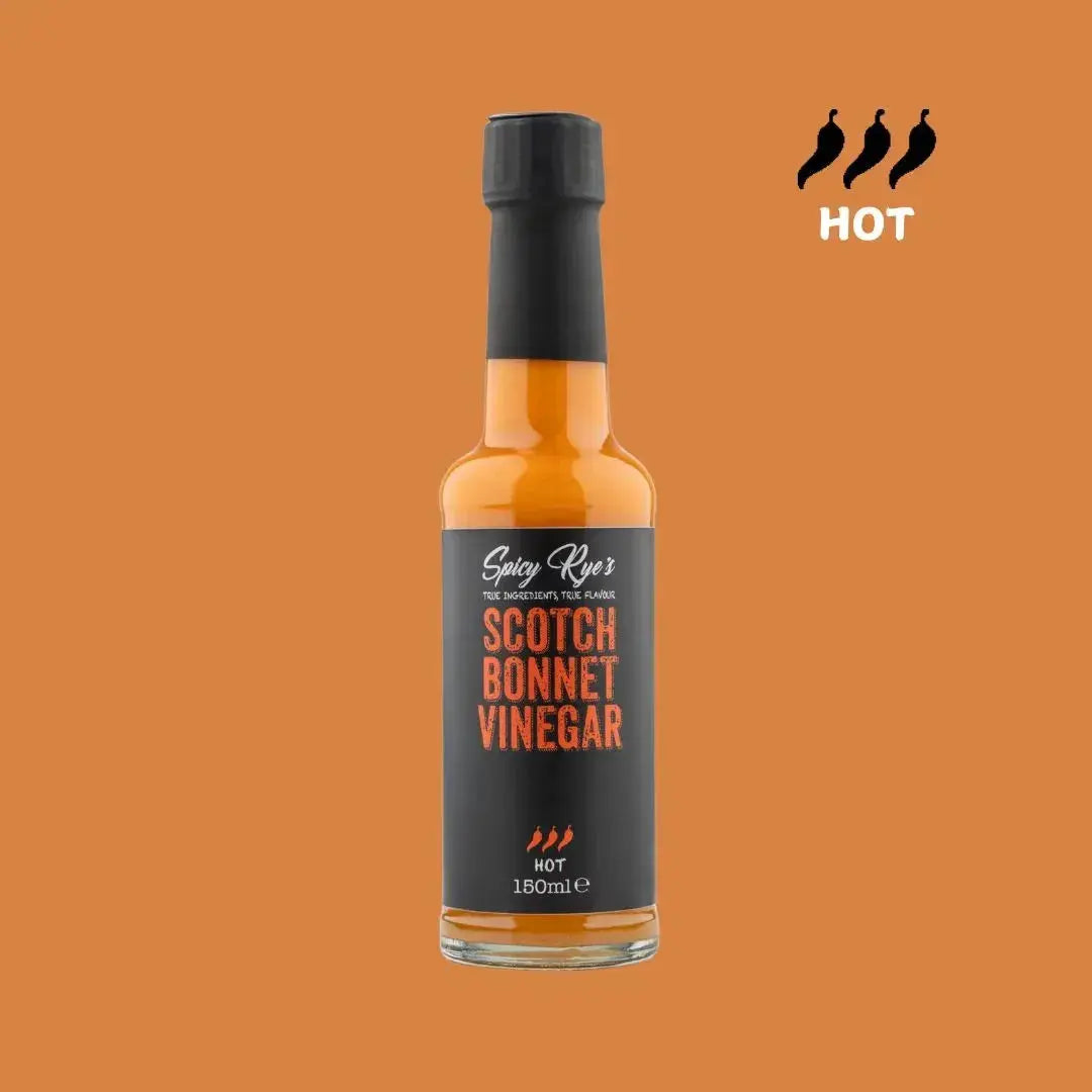Spicy Ryes Scotch Bonnet Vinegar bottle with label, showcasing vibrant orange Scotch bonnet peppers and clear vinegar inside.