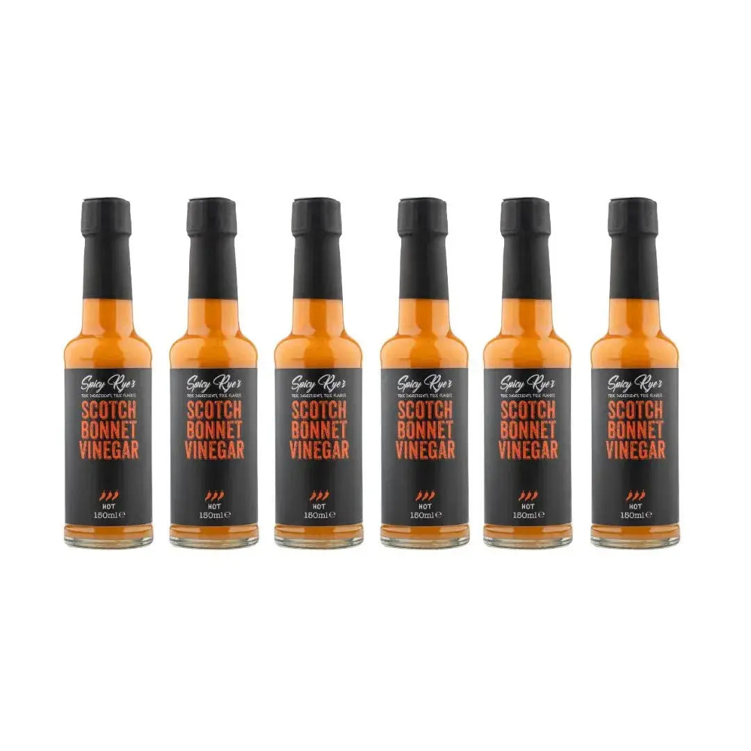 Six bottles of Spicy Ryes Scotch Bonnet Vinegar with colorful labels and glass bottles on a white background.