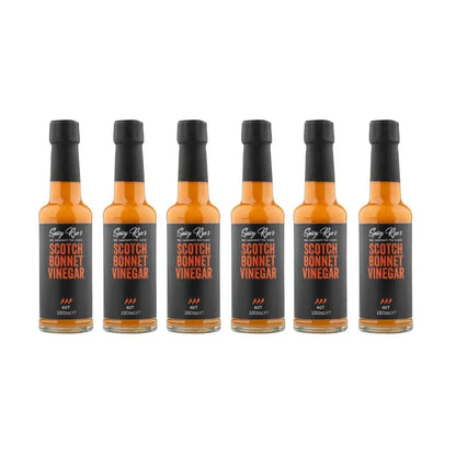 Six bottles of Spicy Ryes Scotch Bonnet Vinegar with colorful labels and glass bottles on a white background.
