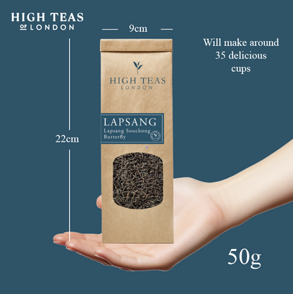 Loose leaf Lapsang Souchong Butterfly tea by High Teas, showing dark, twisted tea leaves in a clear container.