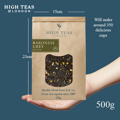High Teas Baroness Grey Blend loose leaf tea in a clear jar with a tea infuser, showcasing the tea leaves and packaging.