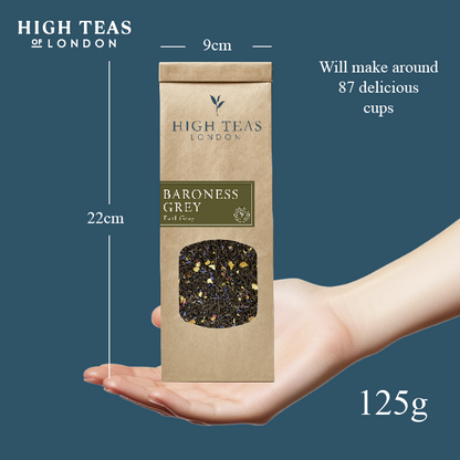 High Teas Baroness Grey Blend loose leaf tea in a clear glass jar with grey and silver packaging, showcasing the tea leaves.