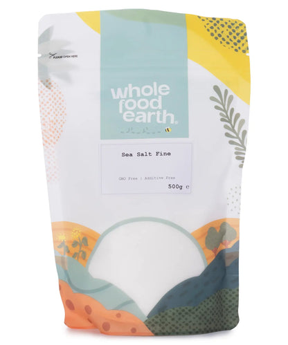 Fine sea salt from Whole Food Earth, 500g, showing the crystalline white mineral salt in a clear container.