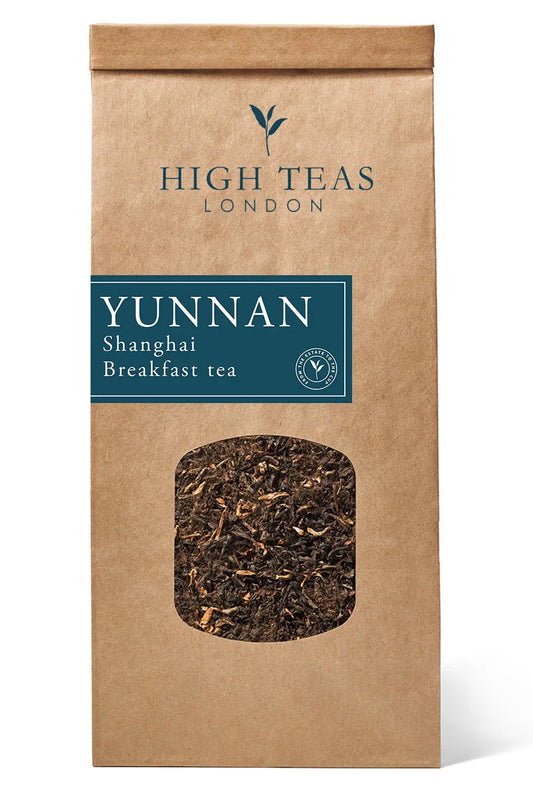 Loose leaf Yunnan Imperial "Gold Tip" Shanghai Breakfast Tea by High Teas in a tea tin with golden tips and rich amber leaves.