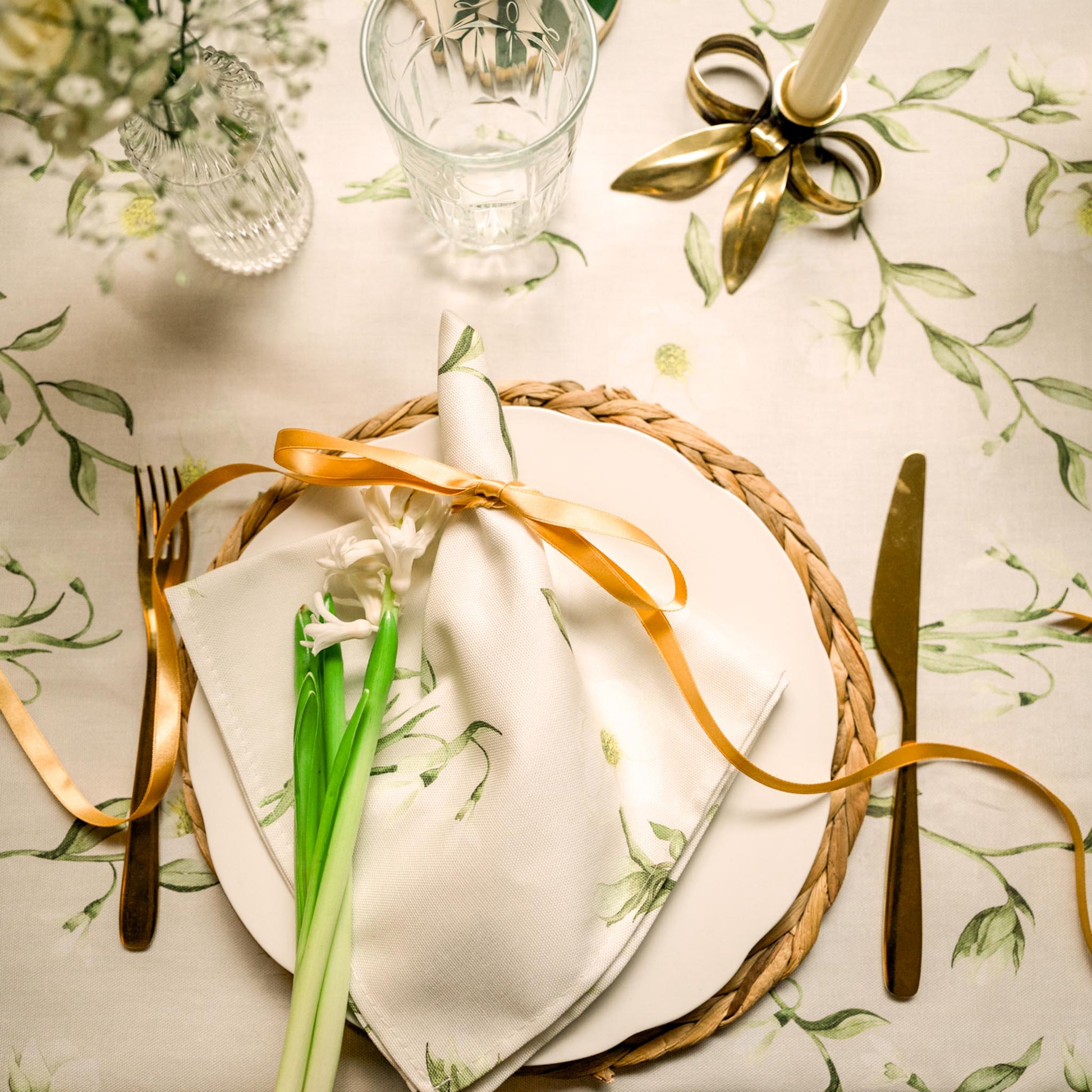 Snowdrop and hellebore floral tablecloth by Avalon Home UK with delicate winter flower patterns for a cozy table setting.