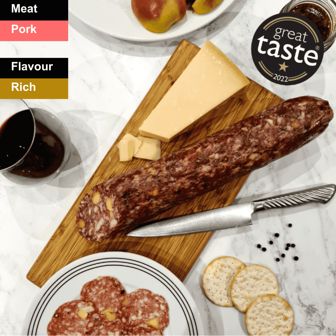 Spicy Berkshire Salami from Bray Cured, sliced charcuterie with a rich, seasoned appearance on a wooden board.