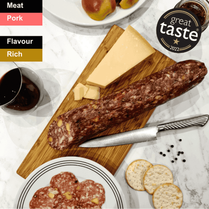 Spicy Berkshire Salami from Bray Cured, sliced charcuterie with a rich, seasoned appearance on a wooden board.