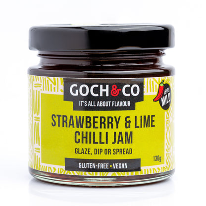 Jar of Goch & Co Strawberry & Lime Chilli Jam showing the colorful jam with fresh strawberries and lime slices.