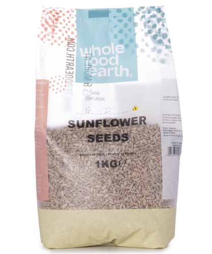 Whole Food Earth sunflower seeds in a 1kg package, showing fresh, whole sunflower seeds ready for snacking or cooking.