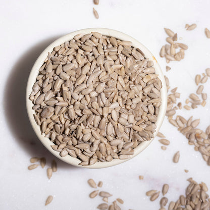 Whole Food Earth sunflower seeds, raw nuts and seeds, close-up of fresh sunflower seeds in a bowl.
