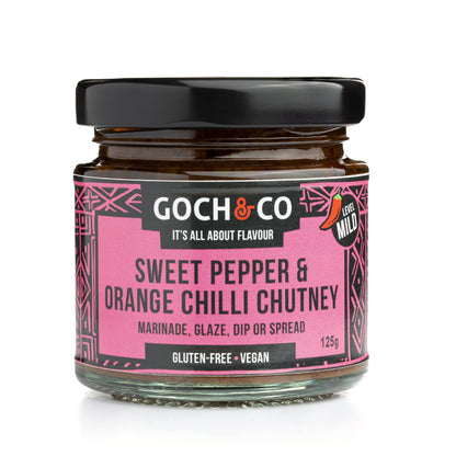 Goch & Co sweet pepper and orange chili chutney in a jar, showcasing vibrant orange and red chili peppers with sweet peppers.