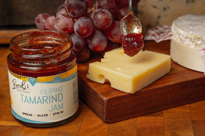 RoniBs Kitchen Filipino Tamarind Jam with Tarsier Gin jar, showcasing the glossy tamarind jelly with a label, perfect for cheese pairing.