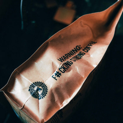Skull Crusher Coffee Skull Crusher Coffee Barrel Aged Skull Crusher Coffee label on a coffee bag