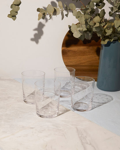 Set of four large crystal tumblers with star design by The Vintage List, featuring elegant, clear glass with star patterns.