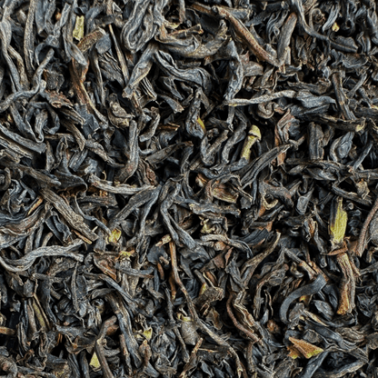 Loose leaf The Clocktower All Day Blend black tea from Porter Hill Tea Company with dark, aromatic tea leaves in a clear container.