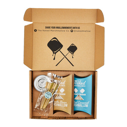The Marshmallow Factory toasting gift set with marshmallow skewers, roasting sticks, and decorative packaging for outdoor roasting.