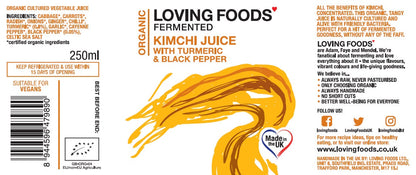 Organic kimchi juice by Loving Foods, fermented vegetable drink with turmeric and black pepper in a glass bottle.