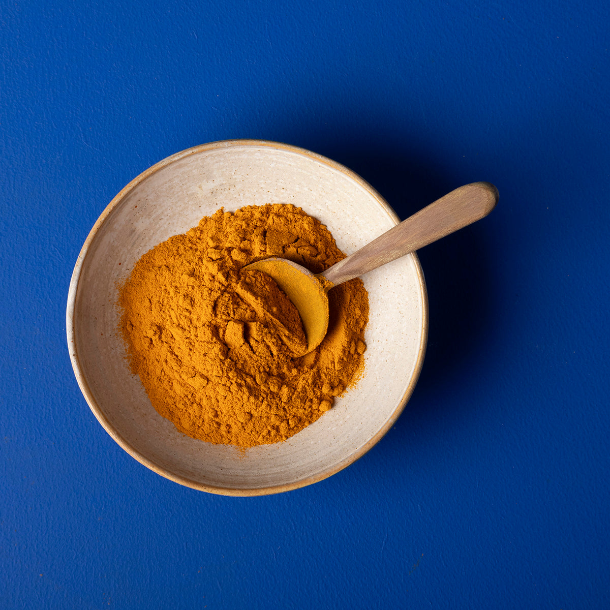 Organic turmeric powder by Wild Elephant in a 150g package, showcasing bright yellow spice in a natural herb and spice product.