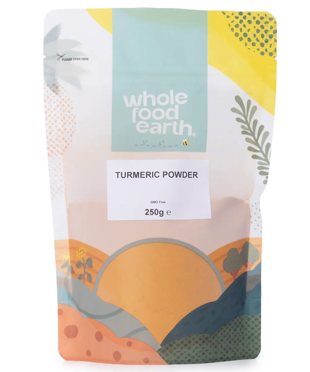 Golden turmeric powder in a 250g package from Whole Food Earth, showing bright yellow powdered spice in a clear container.