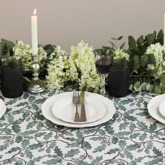 English Oak tablecloth by Avalon Home UK with a classic oak pattern, draped over a dining table for a rustic, elegant look.
