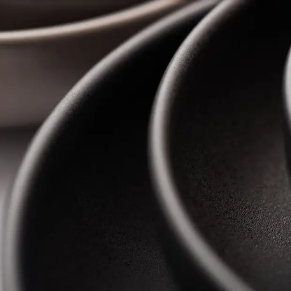Black coupe plate from Glassware UK, 11-inch (28cm) ceramic plate with a sleek, minimalist design for elegant table settings.