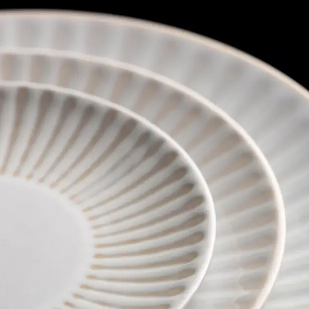 Venus Coupe Plate 11-inch glass plate by Glassware UK, showcasing its elegant curved design and clear glass finish.