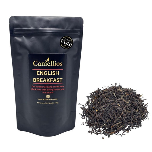 Loose leaf English Breakfast tea by Camellios, showing a close-up of dark, aromatic tea leaves in a natural setting.