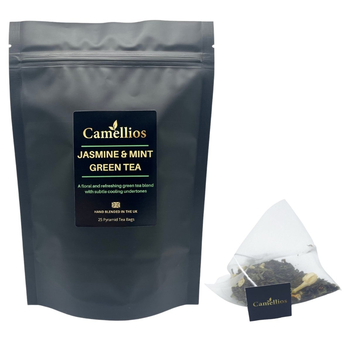 Camellios Jasmine and Mint Green Tea in a clear glass cup with tea leaves and fresh mint leaves, showcasing a soothing herbal infusion.