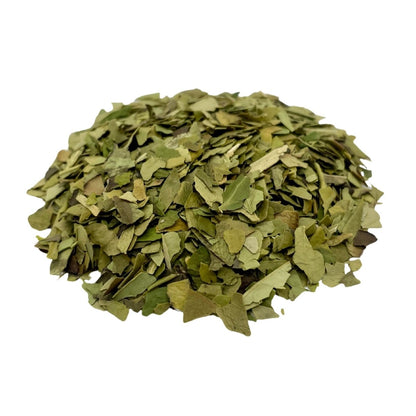 Loose leaf Yerba Mate tea from Camellios, with fresh green leaves and stems for traditional infusion and herbal flavor.