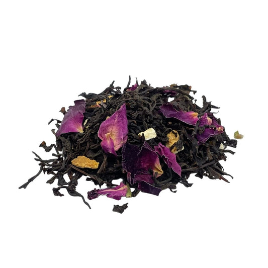 Loose leaf Earl Grey tea from Camellios in a clear jar, showcasing dark tea leaves infused with citrus and bergamot aroma.