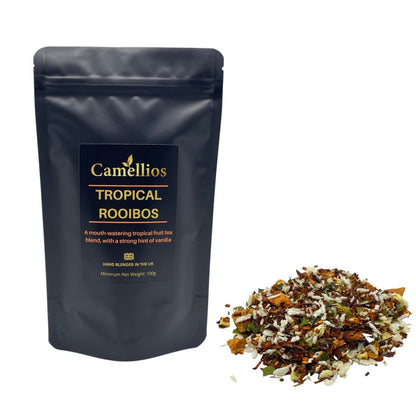 Loose leaf Tropical Rooibos tea from ArtisanBox with vibrant red-brown leaves in a clear glass jar.