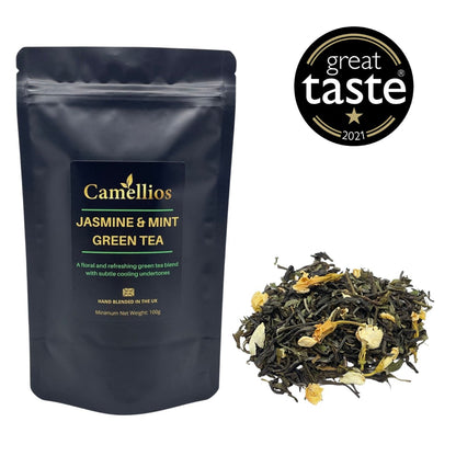 Loose leaf Jasmine & Mint Green Tea by Camellios, showcasing fresh green tea leaves blended with jasmine flowers and mint leaves.