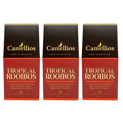 Camellios Tropical Rooibos tea infusion in a glass cup with vibrant tropical fruits and herbs, showcasing a colorful, aromatic tea blend.