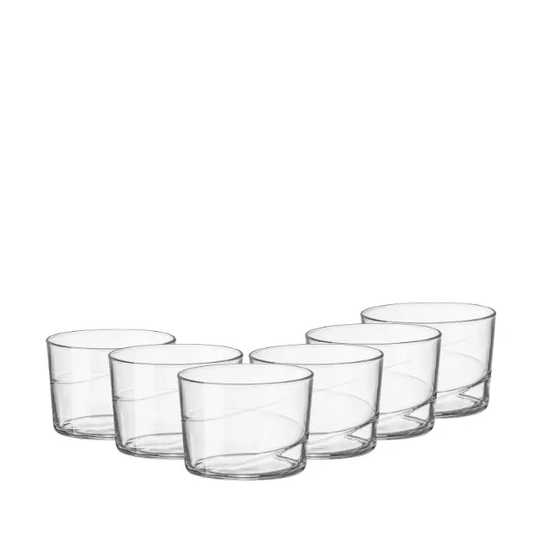 Set of six Bormioli Rocco Swirl mini whisky tumblers with clear glass and swirling pattern, ideal for serving spirits.
