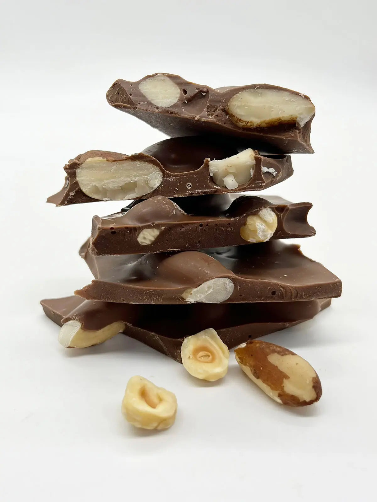 Handmade milk chocolate shards with a nutty texture from Gorvett & Stone, showcasing their very nutty chocolate shards.
