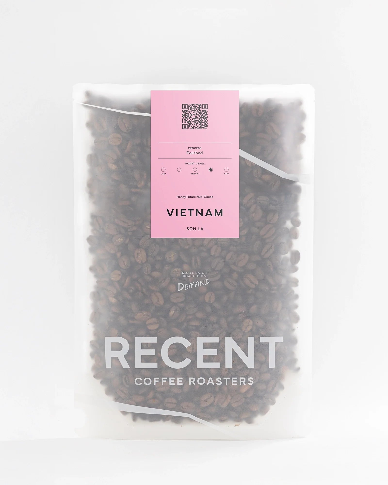Recent Beans Son La G1 medium dark roast coffee bag with a label featuring Vietnamese coffee branding and rich dark roast color.