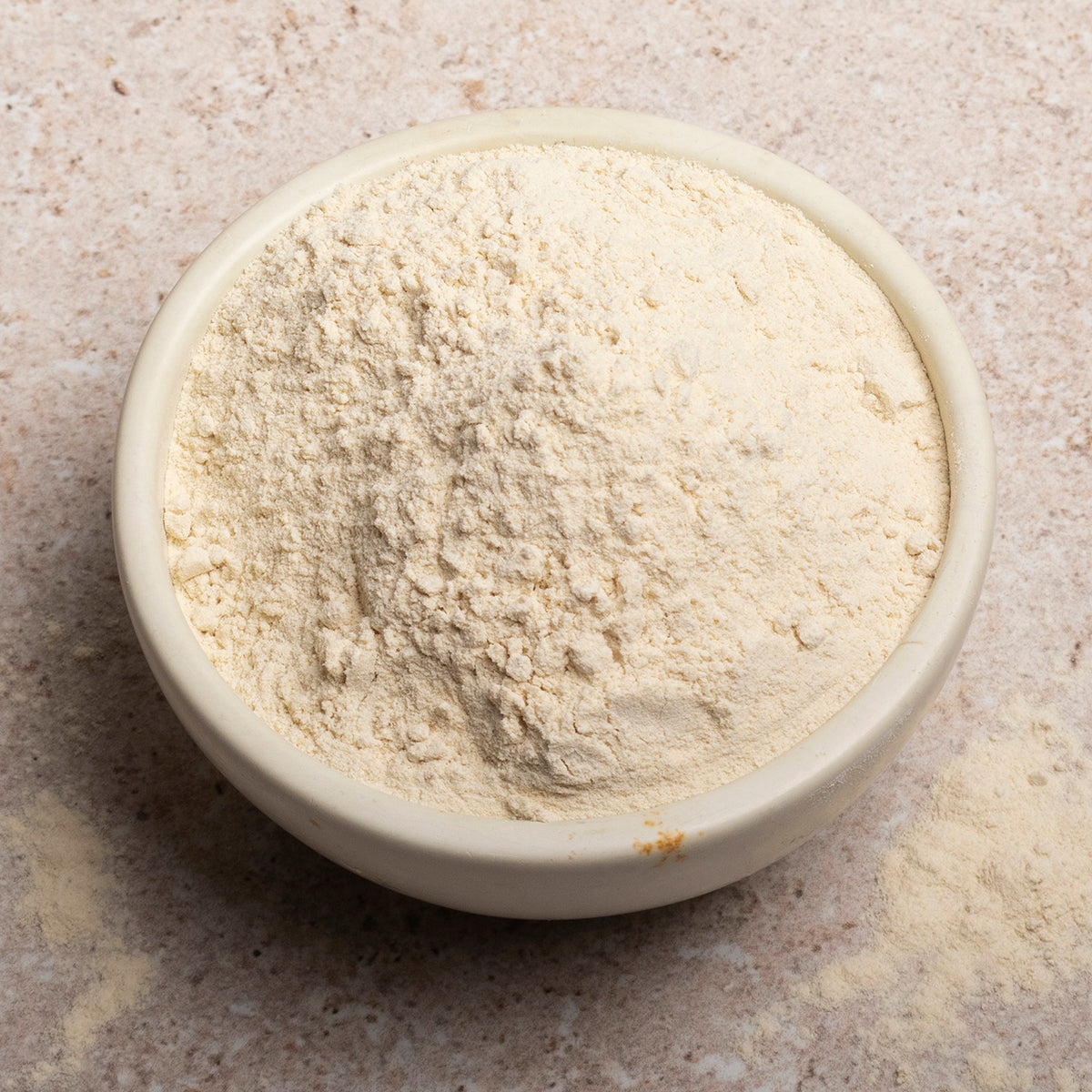 Vital wheat gluten flour from Whole Food Earth, showing a close-up of the gluten powder in a bowl for baking and cooking.